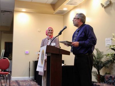 Rev. Larry Wik Lake Orion United Methodith Chucrh-2019 Interfaith Champion Award — with Rouzana Hares and Lake Orion United Methodist Church.